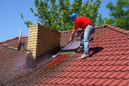 Should I Try To Clean My Own Roof Or Hire A Professional?